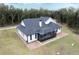 Aerial view of the house and surrounding landscape at 3493 Edwards Road, Lady Lake, FL 32159