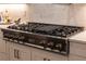 High-end kitchen features a ZLINE gas cooktop with a built-in griddle at 3493 Edwards Road, Lady Lake, FL 32159