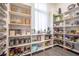 Large walk-in pantry offers extensive shelving for storage needs at 3493 Edwards Road, Lady Lake, FL 32159