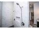 Elegant shower with marble tile and dual shower heads at 3493 Edwards Road, Lady Lake, FL 32159