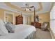 Bright and airy bedroom with a comfortable bed and sitting chair at 3545 Lia Ln, The Villages, FL 32163