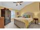 Spacious bedroom with a king-size bed and a large closet at 3545 Lia Ln, The Villages, FL 32163