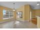 Sunny dining area bathed in natural light, featuring large windows and neutral tile flooring throughout at 35808 Rose Moss Ave, Leesburg, FL 34788