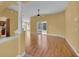 Bright living room with wood floors, neutral walls, and views of the outdoor space at 35808 Rose Moss Ave, Leesburg, FL 34788