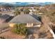 An aerial shot shows the back of a one-story home and surrounding trees at 35808 Rose Moss Ave, Leesburg, FL 34788