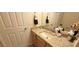 Bathroom with granite countertops, modern sink, and towel set at 3621 Amelia Ave, The Villages, FL 32162