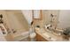 Bathroom with granite countertops and bathtub and shower combination at 3621 Amelia Ave, The Villages, FL 32162