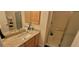 Bathroom with granite countertop vanity and shower at 3621 Amelia Ave, The Villages, FL 32162