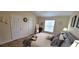 Comfortable bedroom with a tray on the bed, soft pillows, and plenty of natural light at 3621 Amelia Ave, The Villages, FL 32162