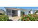 Charming home with a screened porch, one-car garage, and beautifully landscaped front yard at 3621 Amelia Ave, The Villages, FL 32162