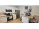Modern kitchen with stainless steel appliances, granite countertops, and a breakfast bar at 3621 Amelia Ave, The Villages, FL 32162