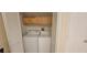 Laundry closet with washer and dryer, and overhead cabinets at 3621 Amelia Ave, The Villages, FL 32162