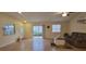 Spacious living room featuring hardwood floors and lots of natural light at 3621 Amelia Ave, The Villages, FL 32162