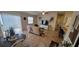 Open-concept living room with sliding glass doors, a leather sofa, and contemporary decor at 3621 Amelia Ave, The Villages, FL 32162