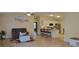 Open-concept living space with a spacious living room and modern kitchen area at 3621 Amelia Ave, The Villages, FL 32162