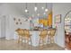 Kitchen with breakfast bar and light wood cabinets at 36341 Grand Island Oaks Cir, Grand Island, FL 32735