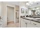 Bathroom with single vanity, shower, and neutral tile at 3962 Neighborly Way, The Villages, FL 32163