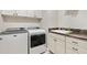 Laundry room with washer, dryer, sink, and cabinets at 3962 Neighborly Way, The Villages, FL 32163