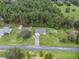 House on a spacious lot with a shed and nearby trees at 39727 Redbud Rd, Lady Lake, FL 32159