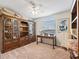 Bright bedroom featuring a built-in wooden desk and large storage shelving at 39727 Redbud Rd, Lady Lake, FL 32159