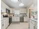 Modern kitchen with white cabinets and granite countertops at 39727 Redbud Rd, Lady Lake, FL 32159