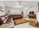 Living room with large sectional sofa, rug, and entertainment center at 39727 Redbud Rd, Lady Lake, FL 32159