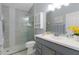 Clean bathroom, walk-in shower, updated vanity, and mosaic tile at 419 Cambio Ct, The Villages, FL 32159