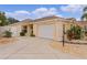 House exterior featuring a single-car garage and landscaping at 419 Cambio Ct, The Villages, FL 32159