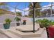 Covered hot tub with surrounding plants and patio at 419 Cambio Ct, The Villages, FL 32159