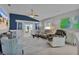 Relaxing living room with grey sectional sofa and view into dining area at 419 Cambio Ct, The Villages, FL 32159