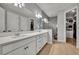 Elegant bathroom with double vanity and walk-in shower at 4637 Cragmere Loop, Clermont, FL 34711