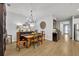 Bright dining room featuring a rustic wooden table and chandelier at 4637 Cragmere Loop, Clermont, FL 34711