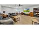 Bright game room featuring a large screen TV and comfy sofas at 4637 Cragmere Loop, Clermont, FL 34711