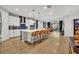 Modern kitchen with white cabinets, a large island, and stainless steel appliances at 4637 Cragmere Loop, Clermont, FL 34711