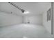 Clean and bright two-car garage with epoxy floors and utility sink at 4654 Ramsell Rd, The Villages, FL 32163