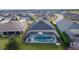 Aerial view of a home with a screened pool, offering privacy and recreation at 4923 Lawler Loop, The Villages, FL 32163