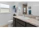 Bathroom with single sink vanity and a view to the shower at 4923 Lawler Loop, The Villages, FL 32163