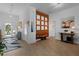 Bright and spacious entryway with wood feature wall and modern flooring at 4923 Lawler Loop, The Villages, FL 32163