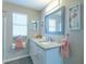 Bathroom featuring granite countertop, white vanity, and modern fixtures with decor at 502 San Marino Dr, Lady Lake, FL 32159