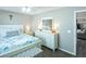 Serene bedroom with an ensuite bathroom and a large chest of drawers at 502 San Marino Dr, Lady Lake, FL 32159