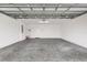 Attached garage with concrete floor and utility sink at 5415 Kate Ct, The Villages, FL 32163