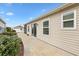 Private patio with concrete slab and landscaping at 5415 Kate Ct, The Villages, FL 32163