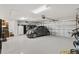 Spacious garage with epoxy flooring and room for storage at 5676 Patterson Loop, The Villages, FL 32163