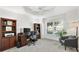 Bright home office featuring built-in shelving and a large window at 5676 Patterson Loop, The Villages, FL 32163