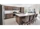 Modern kitchen featuring stainless steel appliances and an island at 5676 Patterson Loop, The Villages, FL 32163