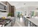 Modern kitchen with stainless steel appliances and white countertops at 5676 Patterson Loop, The Villages, FL 32163