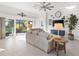 Living room with sliding glass doors leading to a relaxing patio at 5676 Patterson Loop, The Villages, FL 32163