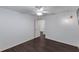Neutral bedroom features dark wood floors and easy access to another room in the house at 583 Arruda Ter, The Villages, FL 32162