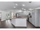 Kitchen featuring gray cabinets, stainless appliances and wood-style floors at 583 Arruda Ter, The Villages, FL 32162