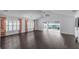 Bright living room with hardwood floors and large sliding doors providing seamless indoor-outdoor flow at 583 Arruda Ter, The Villages, FL 32162
